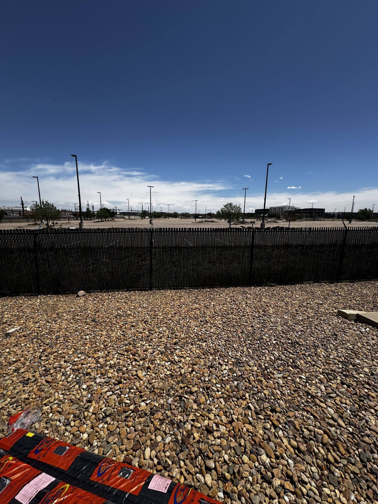 Black ornamental iron fencing at a commercial site